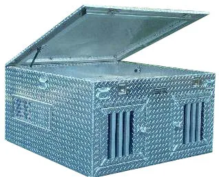 Made with welded diamond tread aluminum it features carrying handles, locking full top storage, locking T-handles on the dog doors, corrugated plastic insulation on all exterior walls, solid aluminum divider panel, dual gas struts, all locks keyed alike, flat lid and slide covers on the vents.