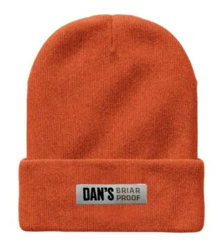 Orange acrylic knit Dan’s cuffed beanie with embroidered logo. High‑visibility hunting beanie featuring Dan’s embroidered branding.